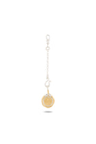 The Midnight Margarita Lime Charm by Jessica de Lotz Jewellery features a short silver chain, a clasp, and a gold coin-like charm adorned with a raised starburst pattern at its center—evoking the style of modern chatelaine accessories or Practical Magic-inspired charms. It is showcased against a plain white background with a subtle shadow beneath.