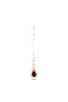 A simple and elegant silver chain from Jessica de Lotz Jewellery, featuring a lobster clasp and decorative hook, finished with the “My Blood, Your Blood, Our Blood Charm”—a teardrop-shaped deep red gemstone set in a silver bezel. Photographed on a white background, this design beautifully highlights the striking pendant, making it an ideal addition to any collection of sisterhood jewelry or Practical Magic-inspired charms.