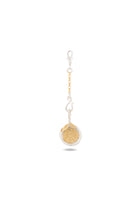A “Midnight Margarita Lime Charm” by Jessica de Lotz Jewellery, featuring a circular gold medallion with a compass rose design, is attached to a small silver chain and clasp—reminiscent of a modern-day chatelaine—and displayed on a white background with a soft shadow beneath.