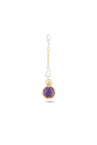 The ’There’s A Little Witch In All Of Us’ Charm by Jessica de Lotz Jewellery features a round amethyst cabochon set in an elegant mix of gold and silver. Suspended from a delicately linked silver and gold chain, this enchanting pendant is showcased against a plain white background. Reminiscent of charms from Practical Magic, it embodies both enchantment and the timeless elegance of a modern-day chatelaine.