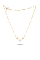 The Practical Magic Chatelaine Hand Necklace by Jessica de Lotz Jewellery features a delicate gold chain with a central clear crystal tube, accented on each side by small gold metal details. The chain is finished with a clasp and an extension ending in a small round charm, and the necklace is elegantly displayed against a white background.