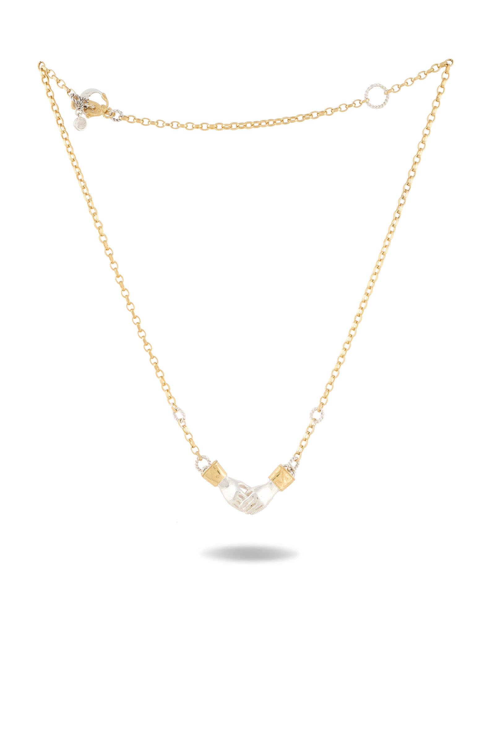 The Practical Magic Chatelaine Hand Necklace by Jessica de Lotz Jewellery features a delicate gold chain with a central clear crystal tube, accented on each side by small gold metal details. The chain is finished with a clasp and an extension ending in a small round charm, and the necklace is elegantly displayed against a white background.