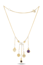 The Practical Magic Chatelaine Hand Necklace (Charm & Chain Bundle) by Jessica de Lotz Jewellery is a gold chain necklace featuring five dangling charms inspired by Practical Magic: a heart, two coins, a round purple stone, and a teardrop-shaped dark red stone. At the center sits a clear crystal with gold accents, echoing the brand’s signature style. The necklace includes a toggle clasp and an extension chain. Shown on a white background.