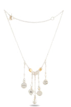 The Practical Magic Chatelaine Holding Hands Necklace (Charm & Chain Bundle) by Jessica de Lotz Jewellery features five round engraved charms dangling from a silver chain and two gold accents near the center, reminiscent of the iconic Chatelaine Holding Hands design. Evoking a hint of practical magic, this piece is displayed against a white background.