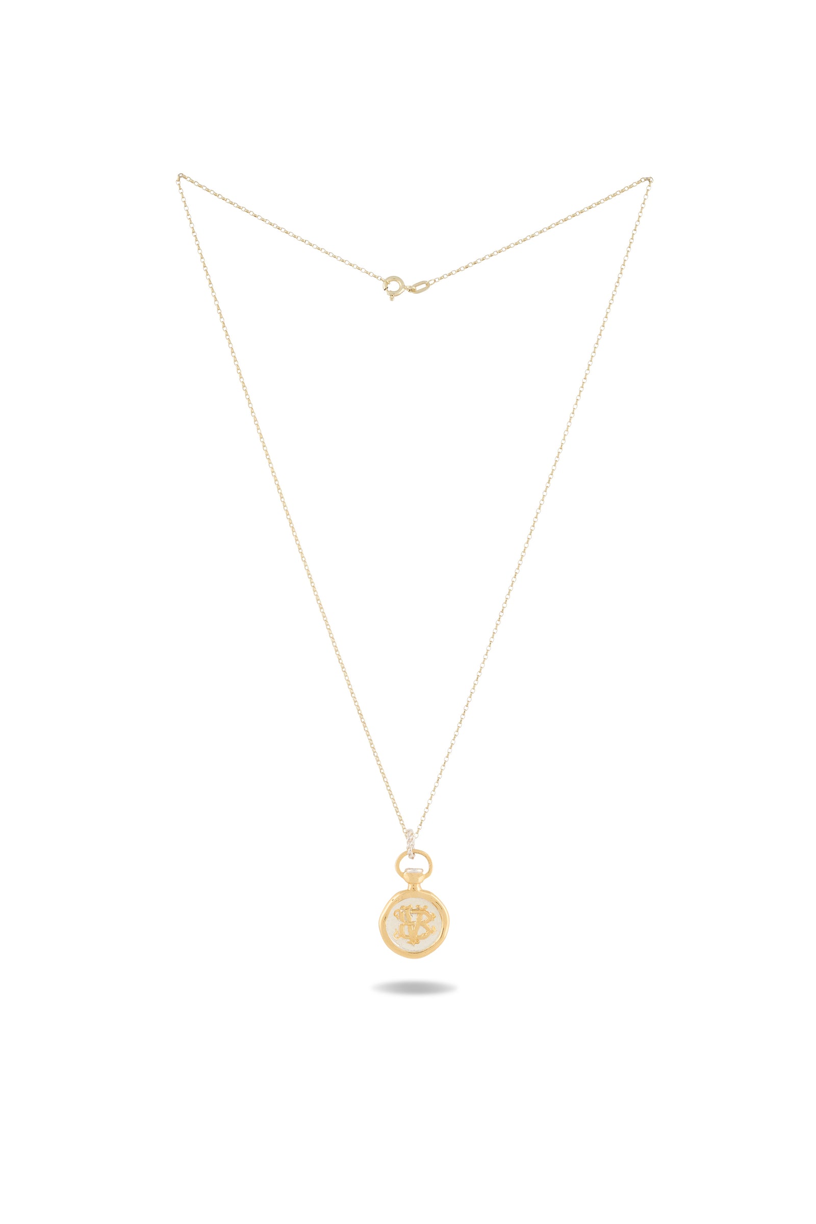 A delicate gold chain necklace from Jessica de Lotz Jewellery, featuring the Verbena Botanical Apothecary Bottle Charm—a small round pendant engraved with a sun motif in the style of a classic botanical wax-seal charm—photographed on a plain white background with the unclasped chain and visible clasp at the top.