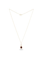 Introducing the Our Blood Pendant by Jessica de Lotz Jewellery—a delicate gold chain necklace showcasing a teardrop-shaped deep red gemstone, elegantly set in a simple gold bezel. Arranged in a triangle on a white background, this timeless piece captures the enchanting allure of Practical Magic charms.