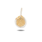 A two-tone gold and silver pendant featuring a circular sunburst design with a small blue gemstone accent, shown on a clean white background with a soft drop shadow. Part of the Practical Magic collection. 