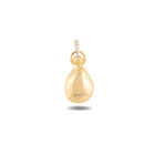 A smooth, shiny gold “Our Blood Pendant” by Jessica de Lotz Jewellery, shaped like a teardrop or small gourd, hangs from a twisted silver loop reminiscent of whimsical Practical Magic charms. A subtle ©WBEI is engraved near the bottom of the pendant. The background is plain white.