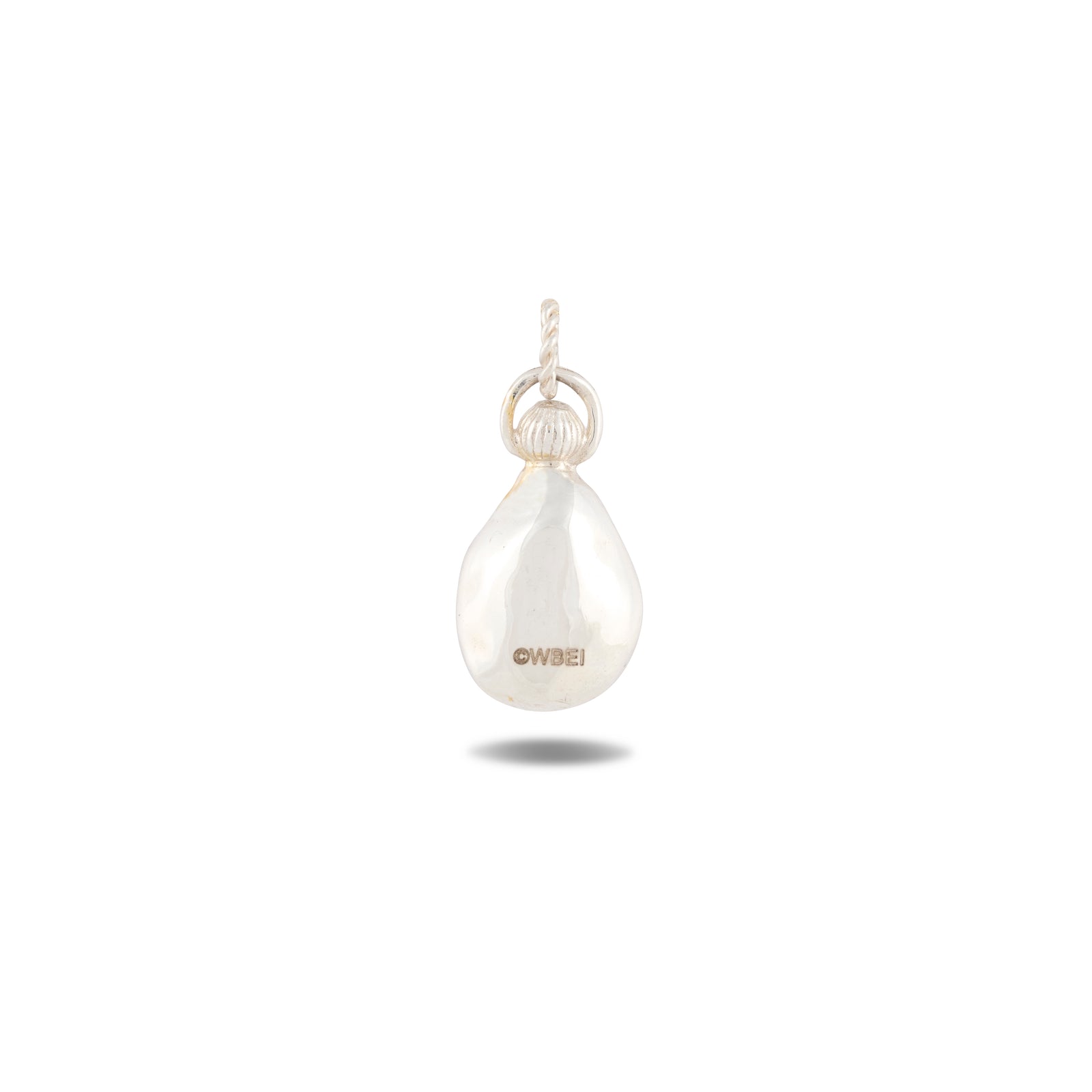 A single, irregularly shaped white pearl pendant with a small metal loop on top for attaching to jewelry. The words “Our Blood” are engraved on the front, reflecting the whimsical style of Jessica de Lotz Jewellery. The pendant casts a faint shadow on a plain white background.
