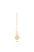 A gold and silver Verbena Botanical Apothecary Bottle Charm by Jessica de Lotz Jewellery, featuring a chain link design with a lobster clasp at the top, an abstract silver S-shaped charm inspired by sisterhood jewelry, and a round gold botanical wax-seal charm with an ornate center design—all beautifully displayed against a white background.