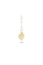 Introducing the Amas Veritas Spell Charm by Jessica de Lotz Jewellery—a graceful piece showcasing a gold-outlined heart with a silver angel nestled inside, suspended from a silver clasp and hook. Evoking the timeless elegance of modern chatelaine style, this charm captures the essence of sisterhood. Presented against a plain white background with a delicate shadow below, its exquisite design is truly highlighted.