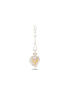 The Amas Veritas Charm by Jessica de Lotz Jewellery is a silver charm with a lobster clasp, featuring a heart-shaped pendant inspired by Practical Magic. The heart has a clear front that reveals delicate gold details within. Set against a plain white background, the charm casts a subtle shadow below.
