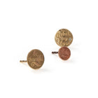 Three JdL Jewellery Sentimental Hand Engraved Studs (Single) are shown on a white background: a gold pin reading "be thankful," a brass one with a gem reading "Unlock my Love," and a copper pin engraved with "Lucky.