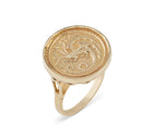 The House of the Dragon & JdL King Viserys I Targaryen Golden Dome Ring by Jessica de Lotz Jewellery features a gold, round flat top engraved with the Targaryen dragon crest, outstretched wings, curled tail, and a split band near the bezel.