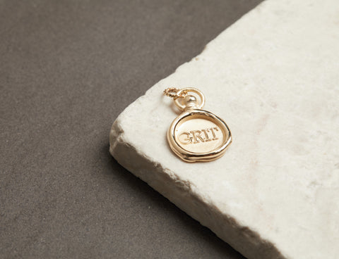 Grit Charm for IWD 2021