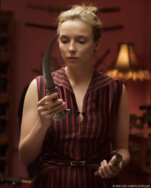 killing eve villanelle holding dagger with jdl jewellery rings on hands copyright BBC America and Sid Gentle Films